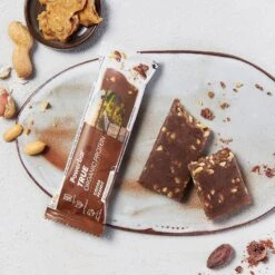 PowerBar True Organic Protein Bar Kakao/Erdnuss Riegel 16x45g Box -Head || Wilson || YONEX Verkäufe Powerbar 21121000 TrueOrganic Cocoa Peanut Tray 2 900x900 1
